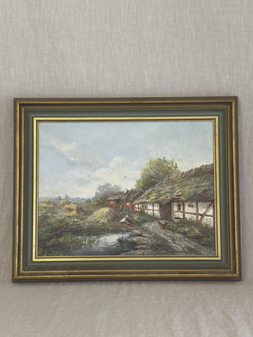 Vintage Swedish oil painting of a thatched half-timbered farmstead with hens and a pond, in a grey-green and gilt frame