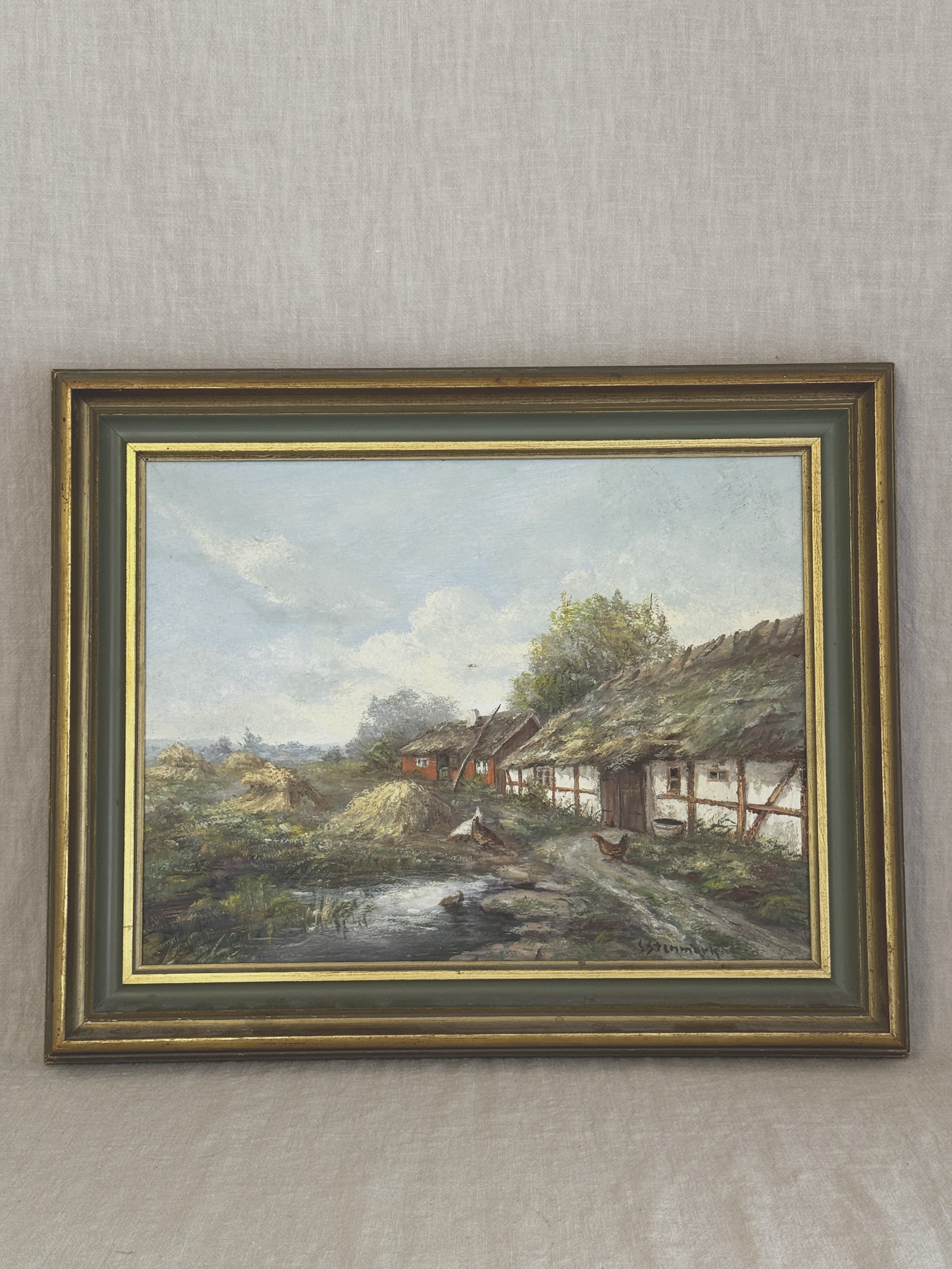 Vintage Swedish oil painting of a thatched half-timbered farmstead with hens and a pond, in a grey-green and gilt frame