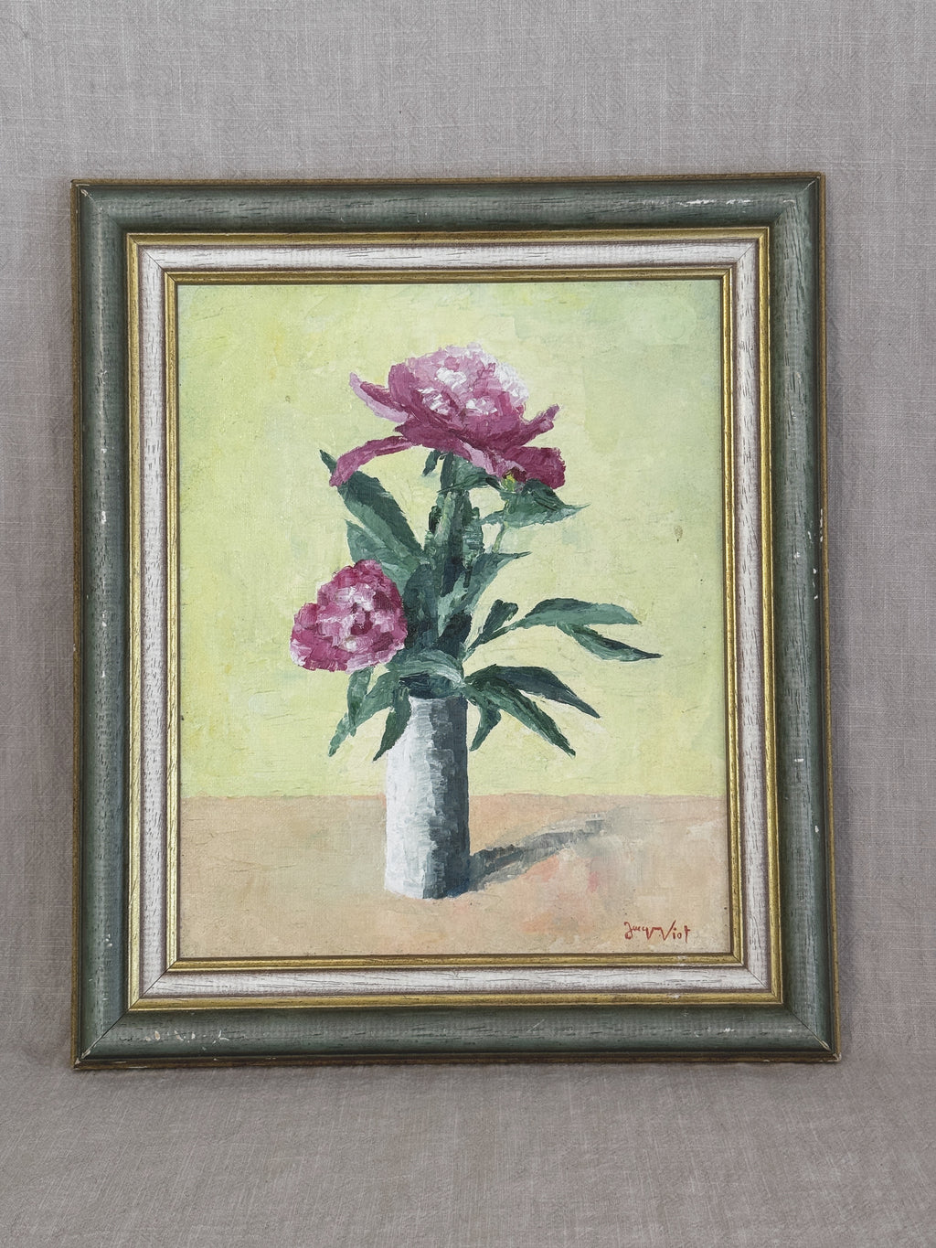 Vintage French oil painting of two pink peonies in a white vase, in a grey-green and cream painted frame