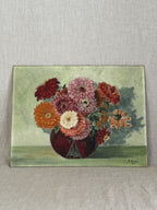 Unframed French oil painting of a zinnia and dahlia bouquet in a dark red vase, dated 1946
