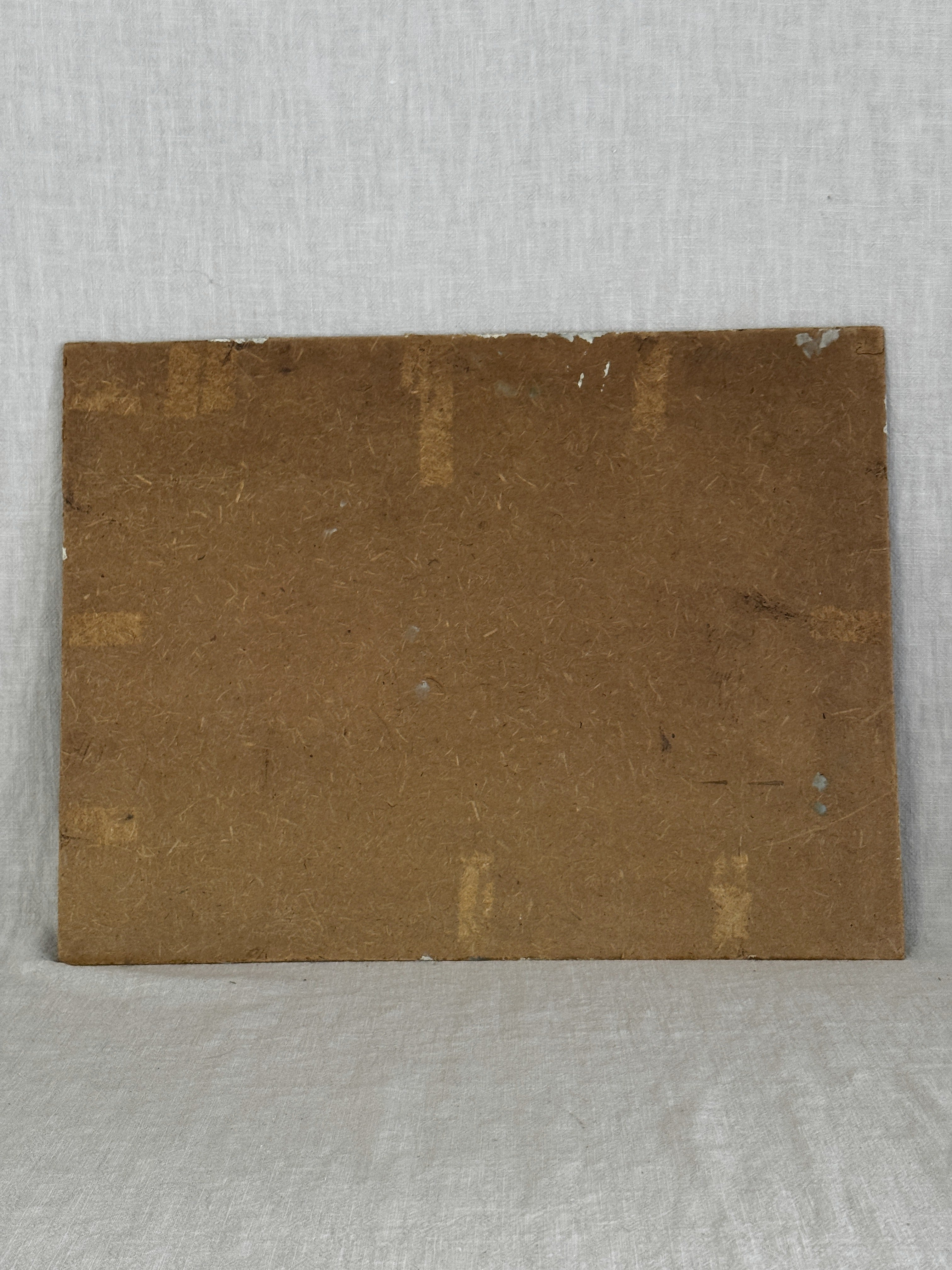 Reverse of the unframed French oil painting showing the brown fibreboard back of the canvas board