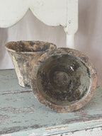 Antique French resin pots in unglazed terracotta, one tipped to show the resin-lined interior
