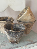 Group of antique terracotta pine sap pots with timeworn resin runs on the outer walls