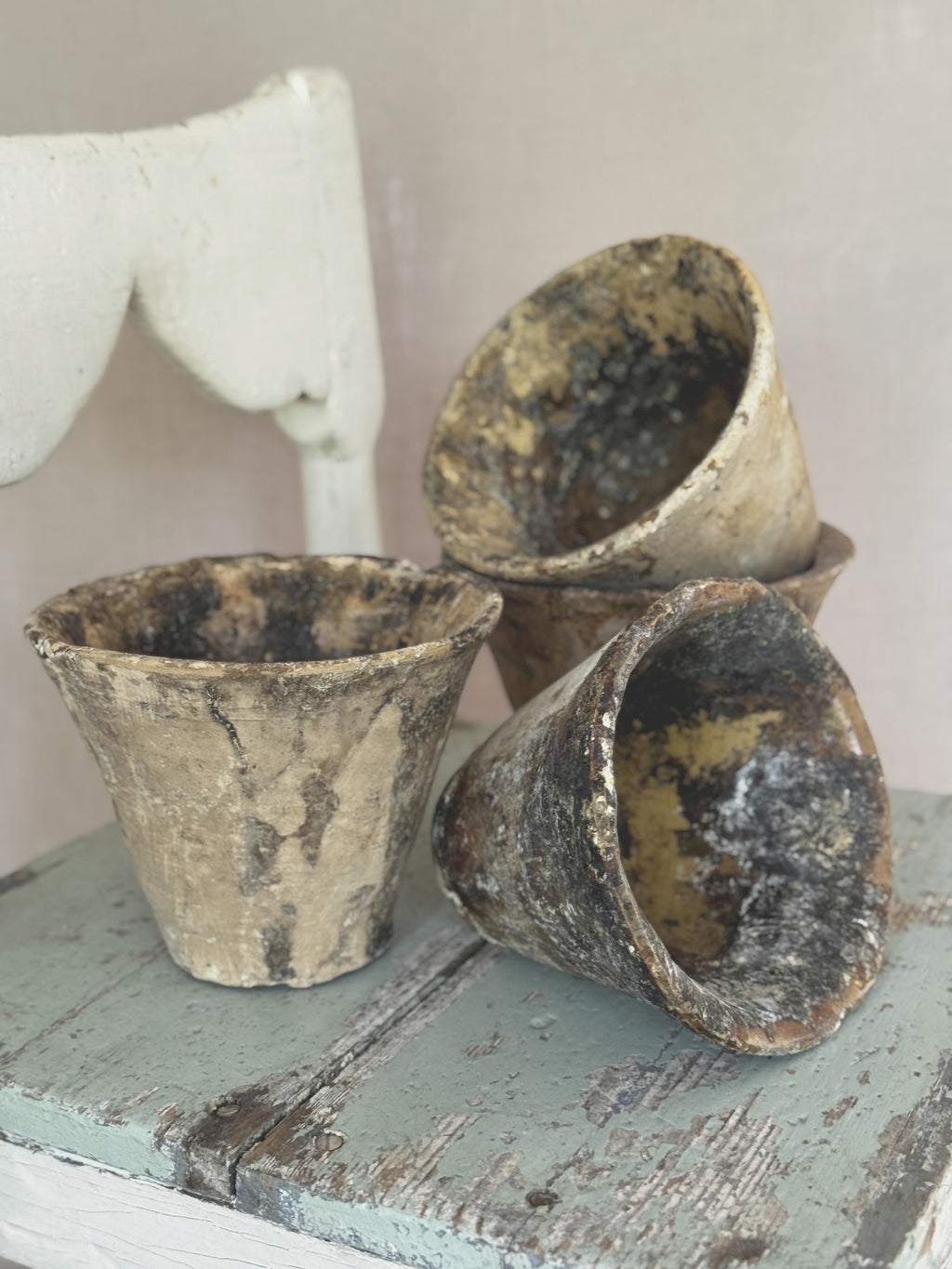 Close view into an antique terracotta resin pot lined with glossy hardened pine resin