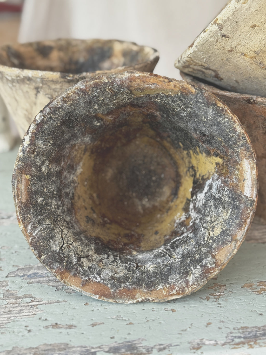 Single antique French terracotta resin pot with a flared rim and dark resin streaks