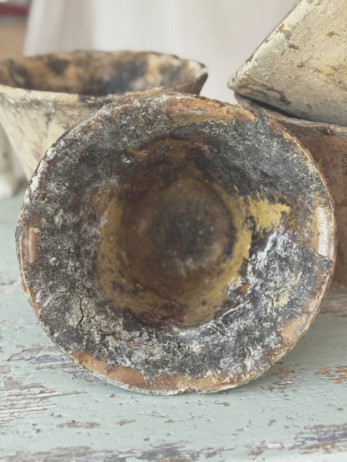 Single antique French terracotta resin pot with a flared rim and dark resin streaks