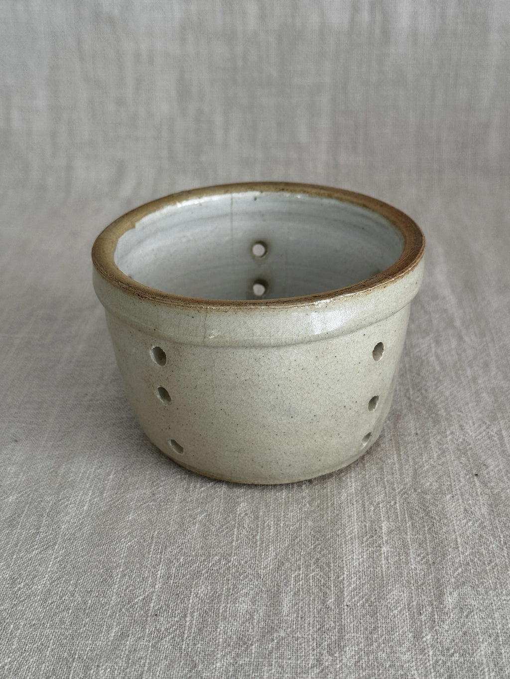 Unglazed base of the larger antique French faisselle in stoneware