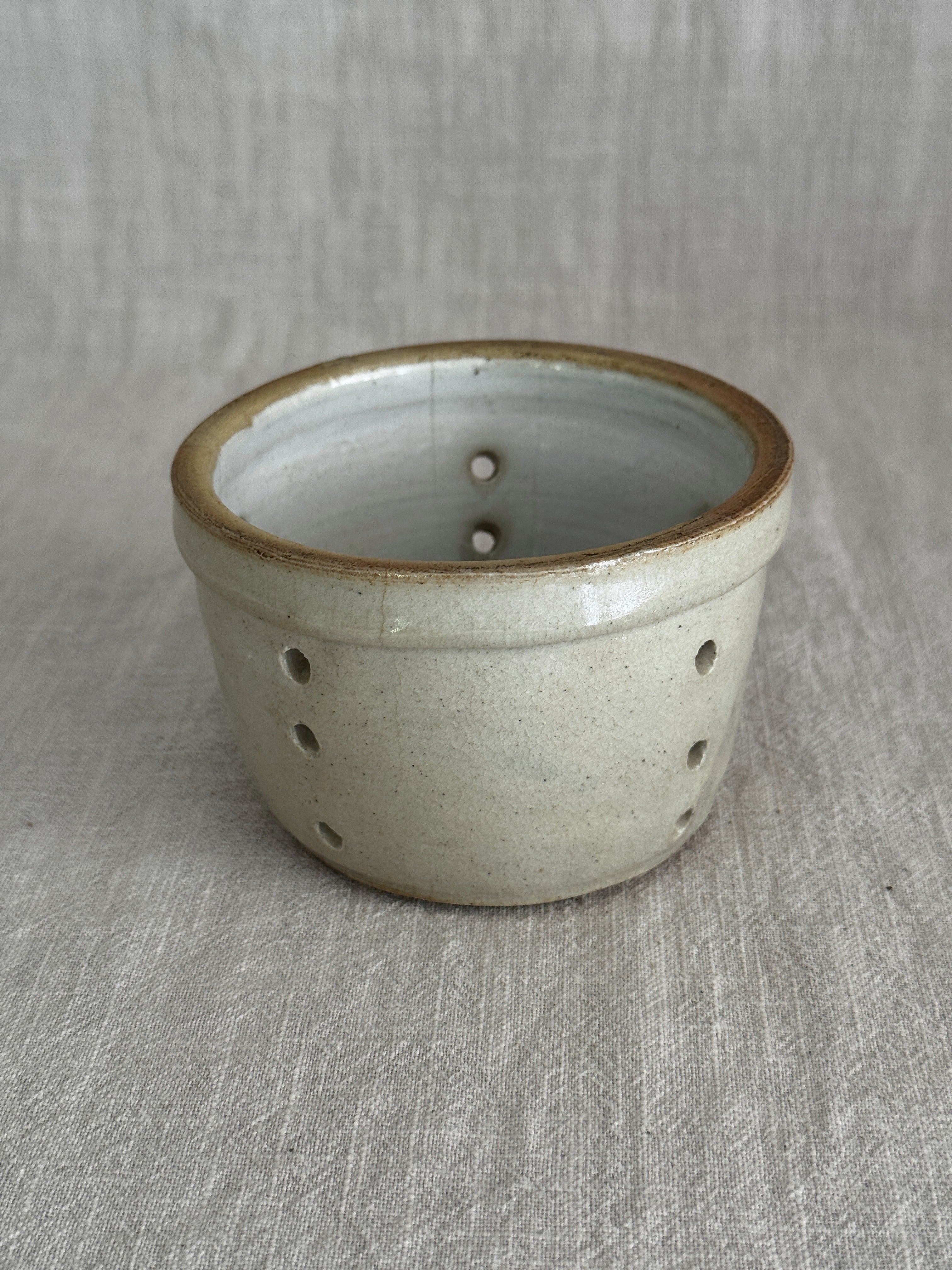Unglazed base of the larger antique French faisselle in stoneware