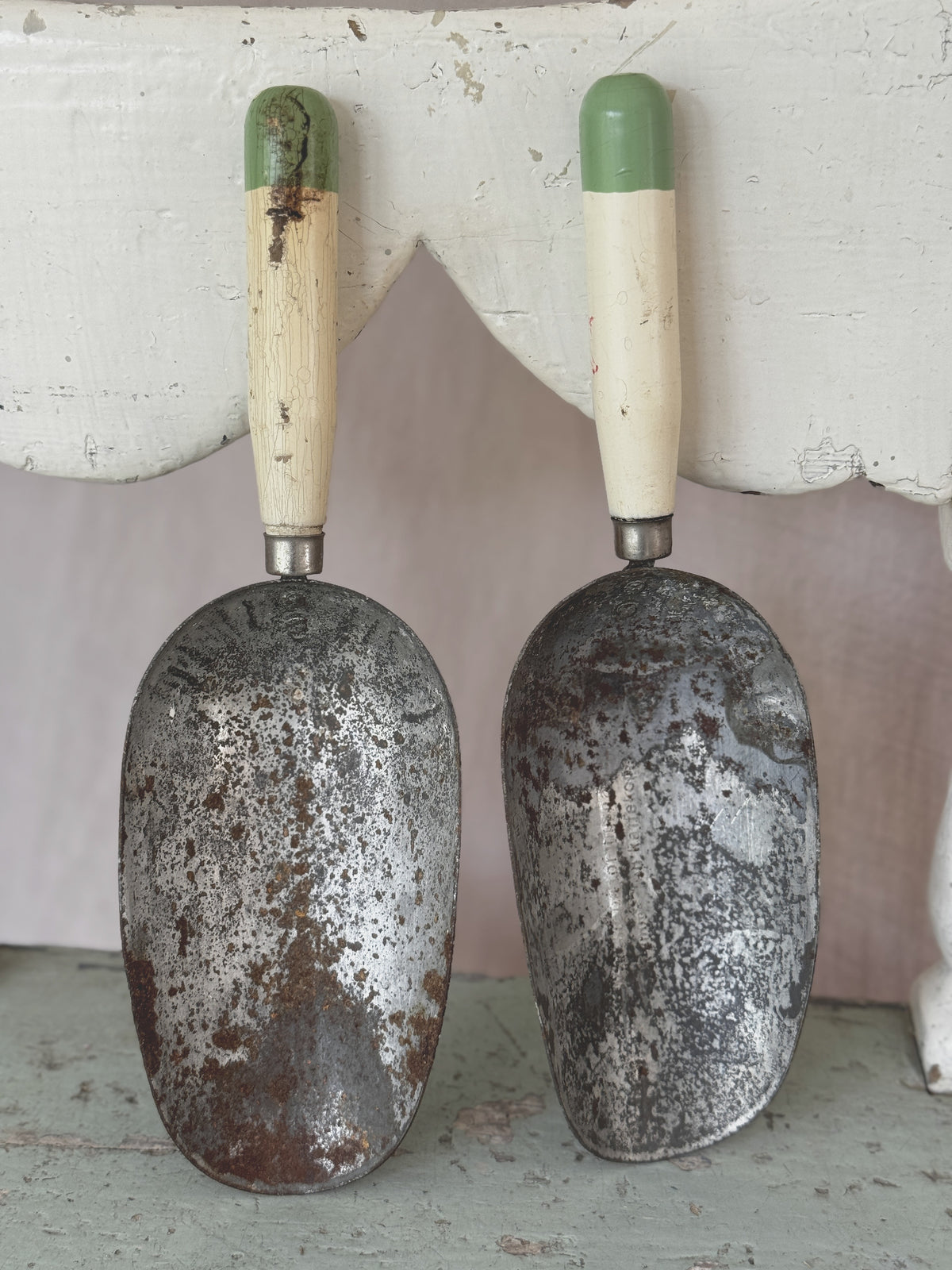 Pair of antique Swedish tin coffee scoops with cream and green painted handles