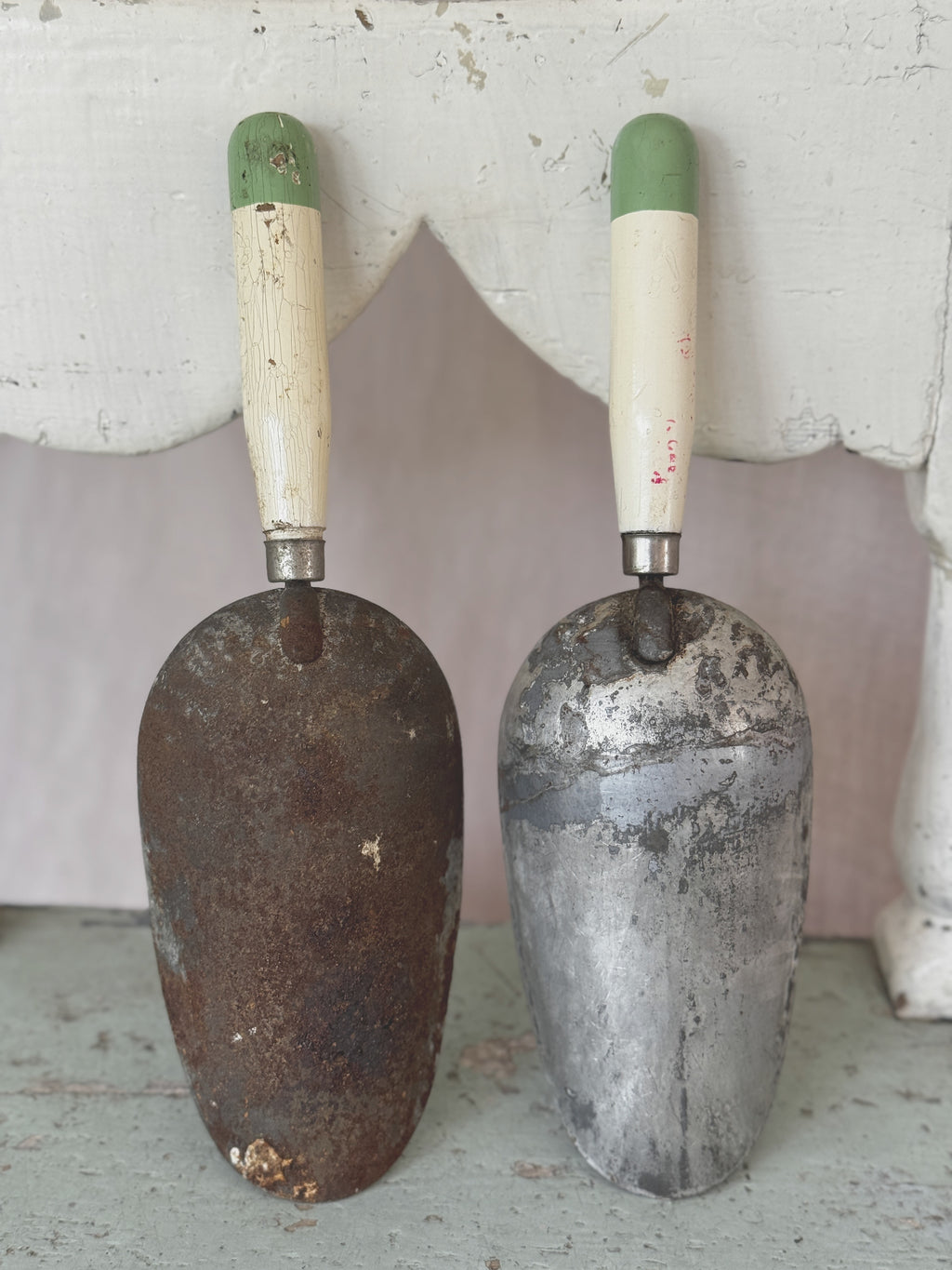 Back of the antique Swedish coffee scoops showing rust and patina