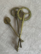 Group of antique brass pastry jaggers with toothed wheels