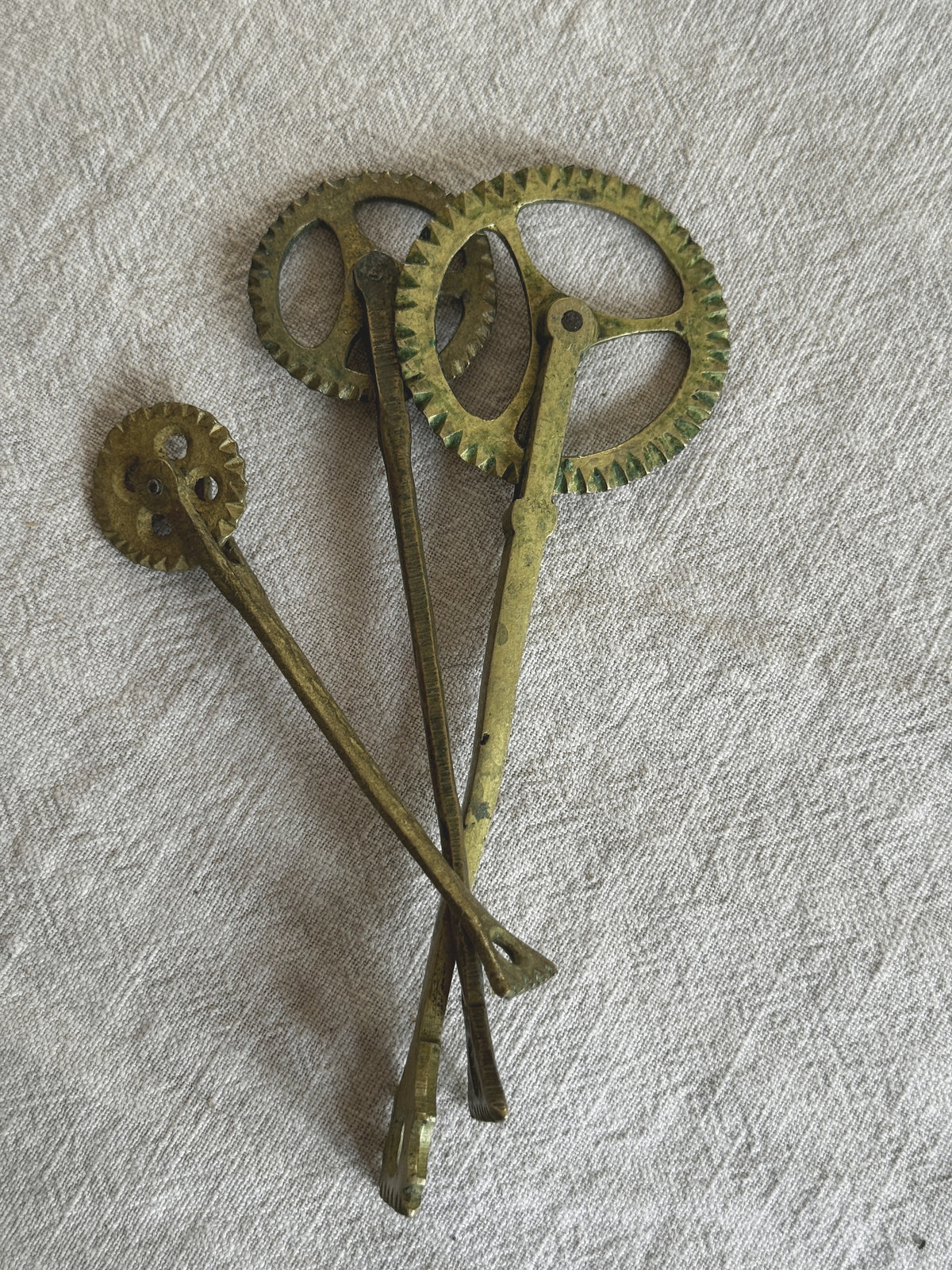 Group of antique brass pastry jaggers with toothed wheels