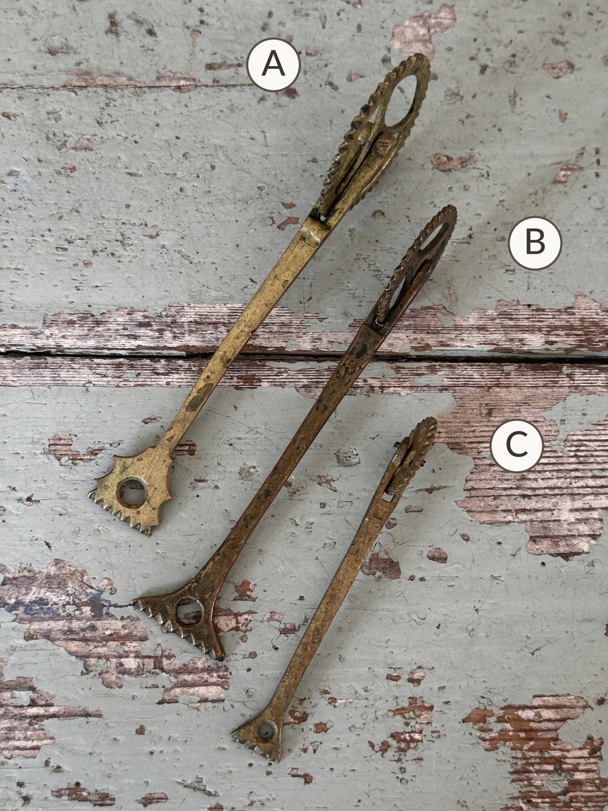 Reverse side of brass pastry jaggers A, B and C showing crimping tips