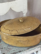 Terrine with lid lifted showing glazed interior
