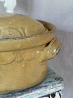 Lug handle and worn glaze on the yellow terrine