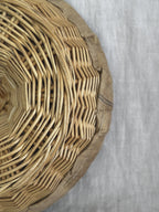 Close-up of the willow weave and the linen edge at the rim of a French bread proofing basket
