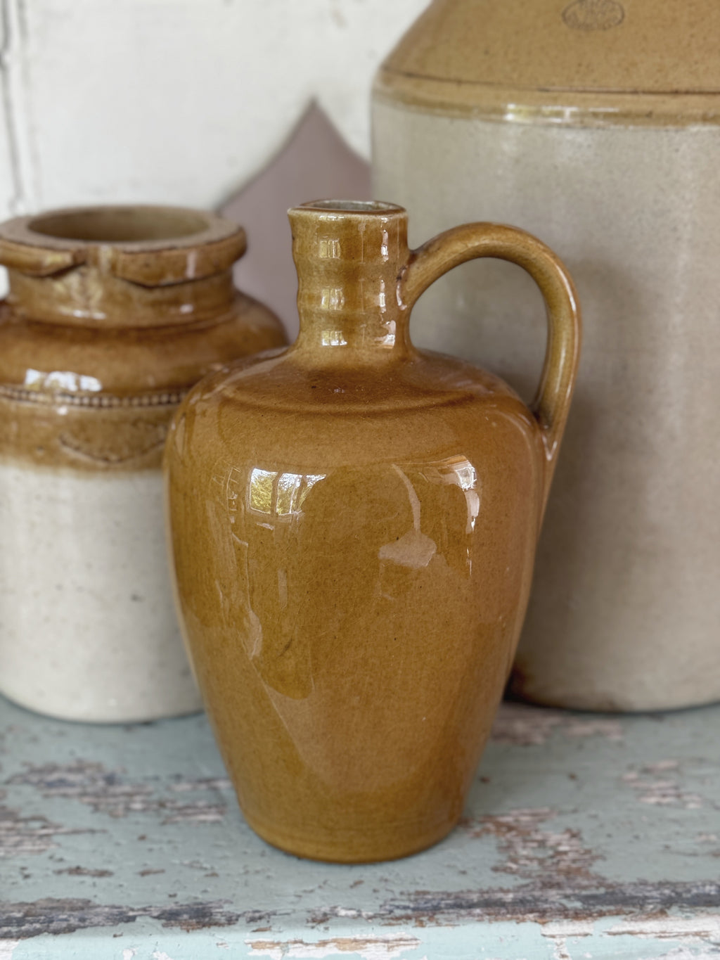 Vintage honey-brown glazed stoneware flagon with loop handle