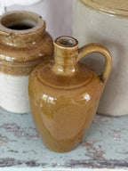 Ringed neck and handle of the brown stoneware flagon