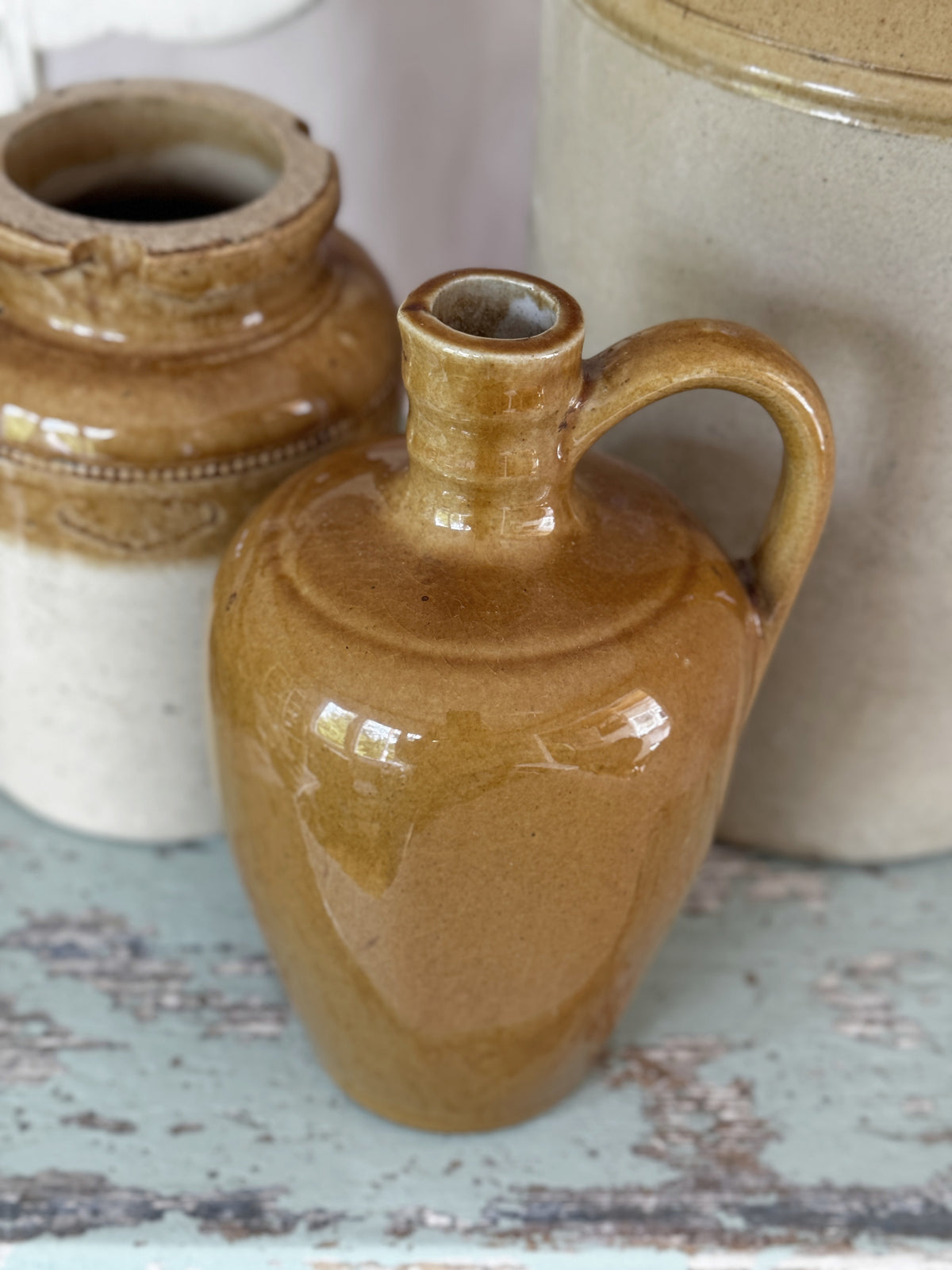 Ringed neck and handle of the brown stoneware flagon