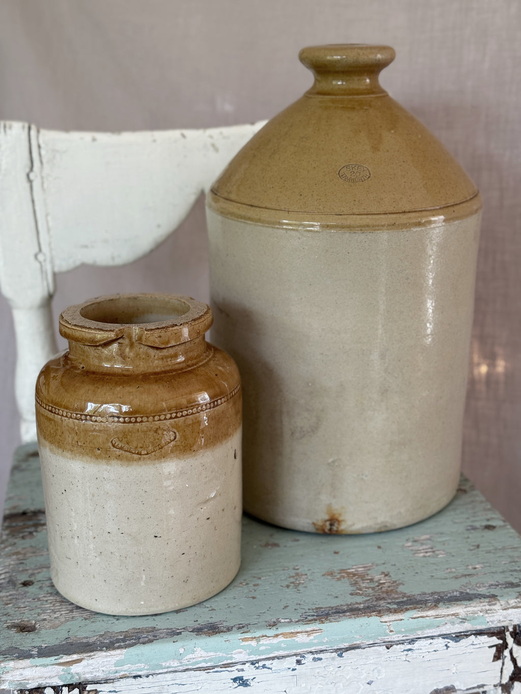 Antique Skey Tamworth two-tone stoneware flagon beside a small jar