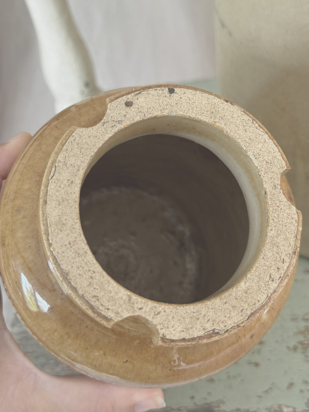 Rim of the Doulton jar with notches for the missing lid