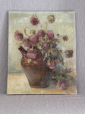 Vintage French still life oil painting from 1956, a bouquet of dusty pink thistles in a brown glazed earthenware jug, unframed canvas against a grey linen backdrop