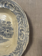 Close-up of the printed border pattern and the fine crazing across the glaze