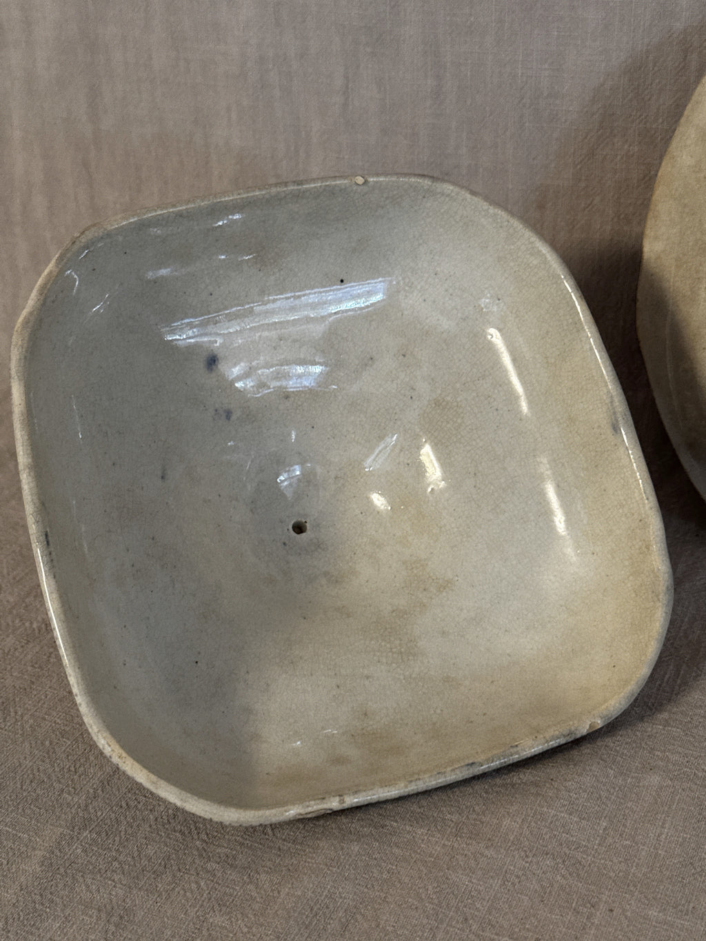 The underside of the lid, plain glazed and unmarked
