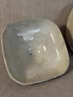 The underside of the lid, plain glazed and unmarked