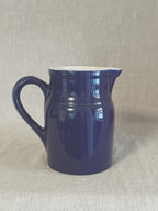 The cobalt blue French pitcher seen from the spout side