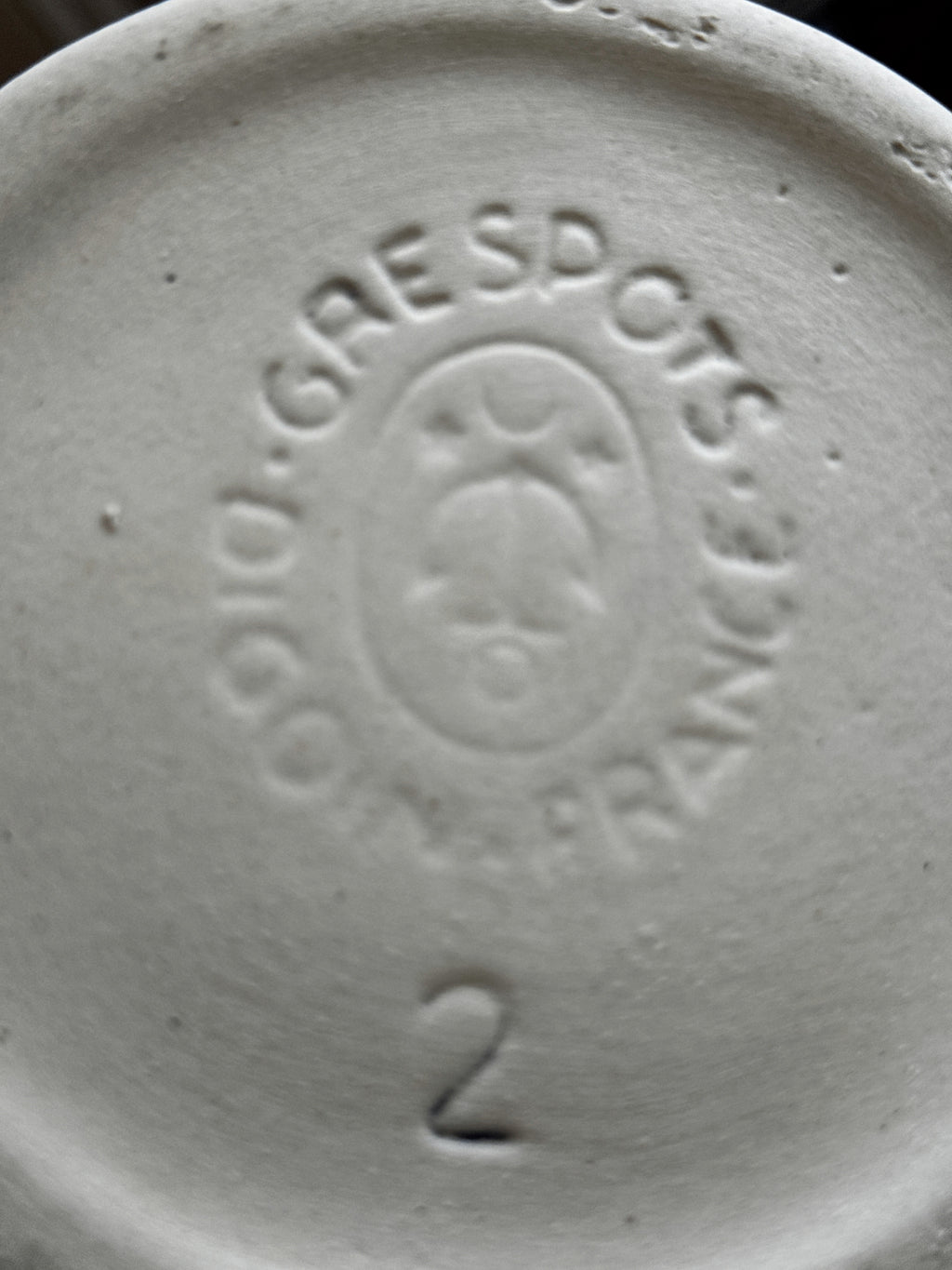Close-up of the impressed DIGOIN GRESPOTS FRANCE factory mark