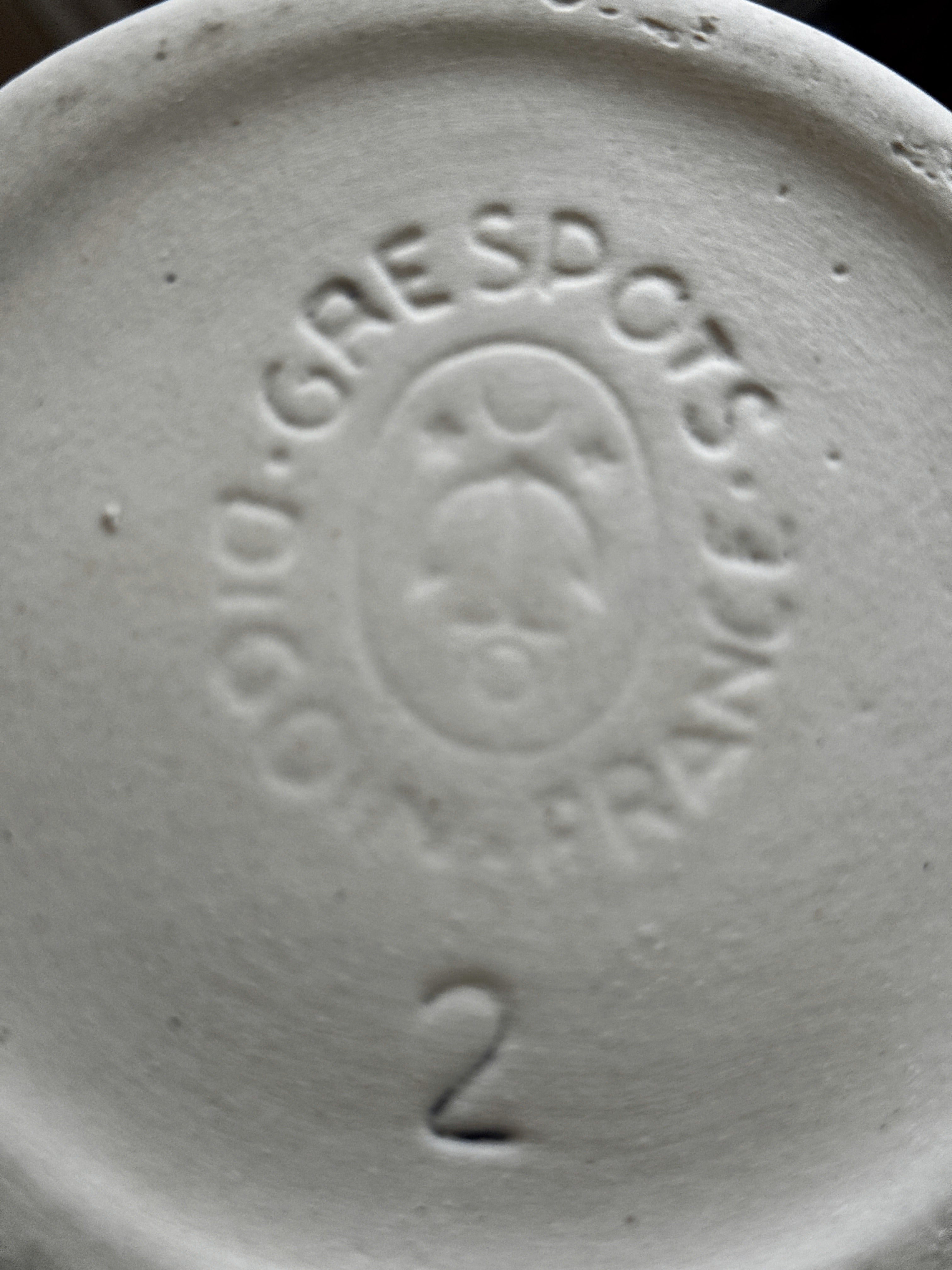 Close-up of the impressed DIGOIN GRESPOTS FRANCE factory mark