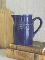 Digoin cobalt blue stoneware pitcher, styled with a bread board and old books
