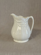 Royal Crownford white ironstone cream jug with drapery moulded rim, one of a pair