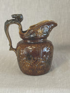 Vintage Arthur Wood treacle glazed relief jug with a modelled horse head handle, Staffordshire earthenware