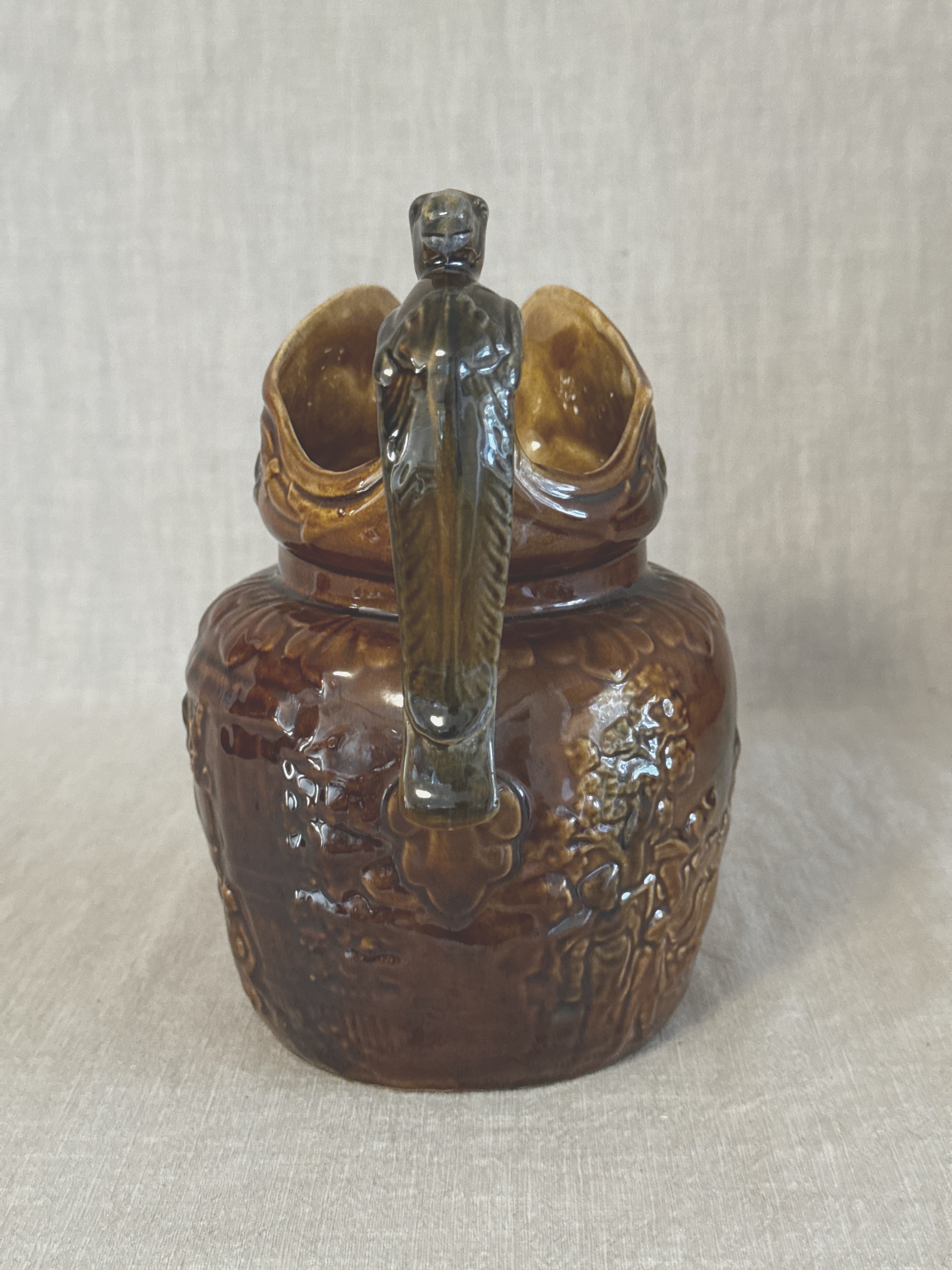 Rear view of the Arthur Wood jug showing the horse head handle from behind