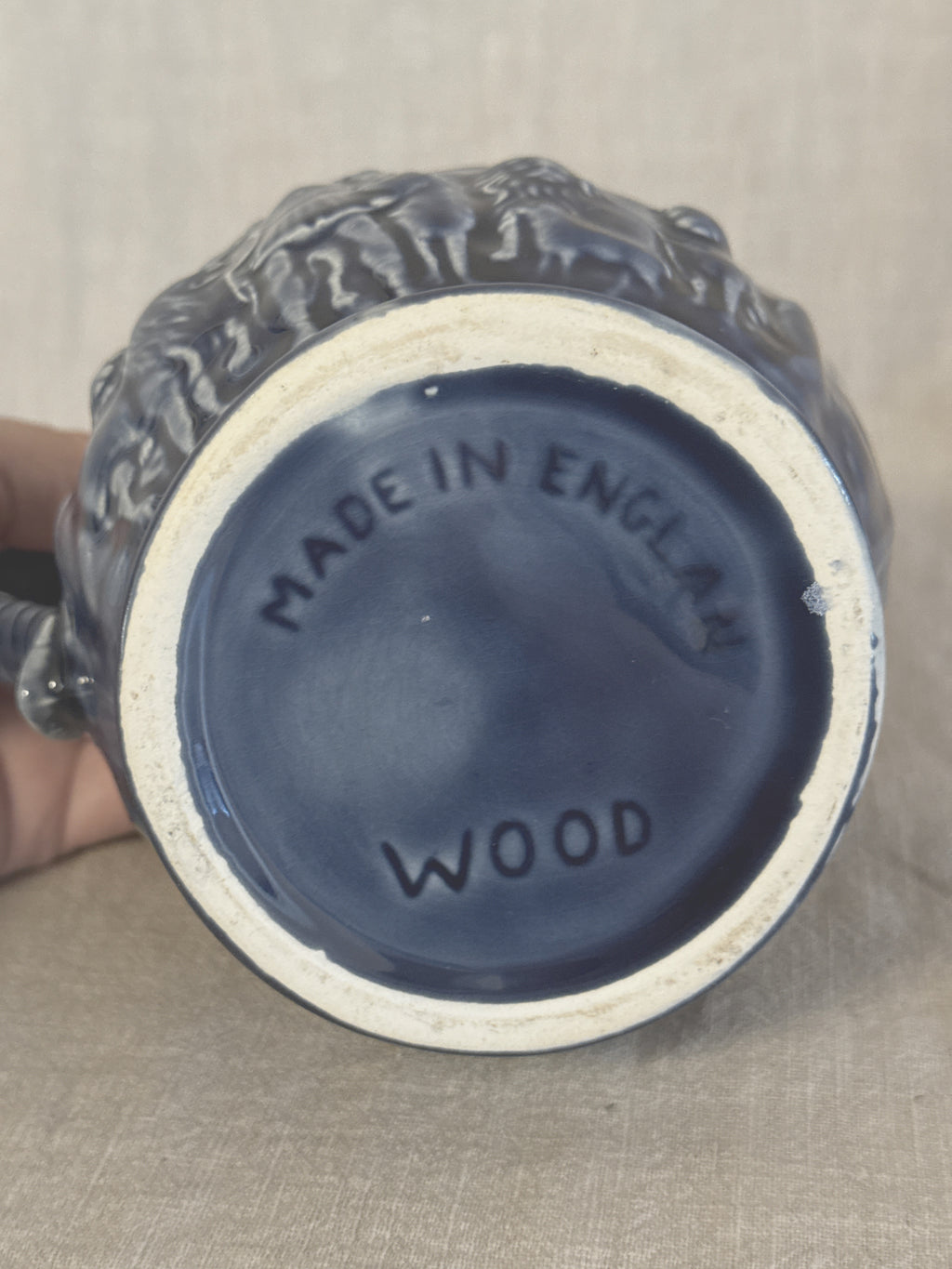 Base of the blue relief jug impressed MADE IN ENGLAND and WOOD