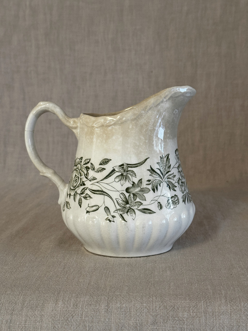 Side view of the Springtime jug showing the fluted body and green transfer
