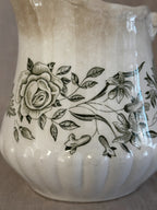 Close-up of the green rose and flower transfer on the jug body
