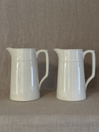The pair of tall white jugs side by side on linen, price is per jug