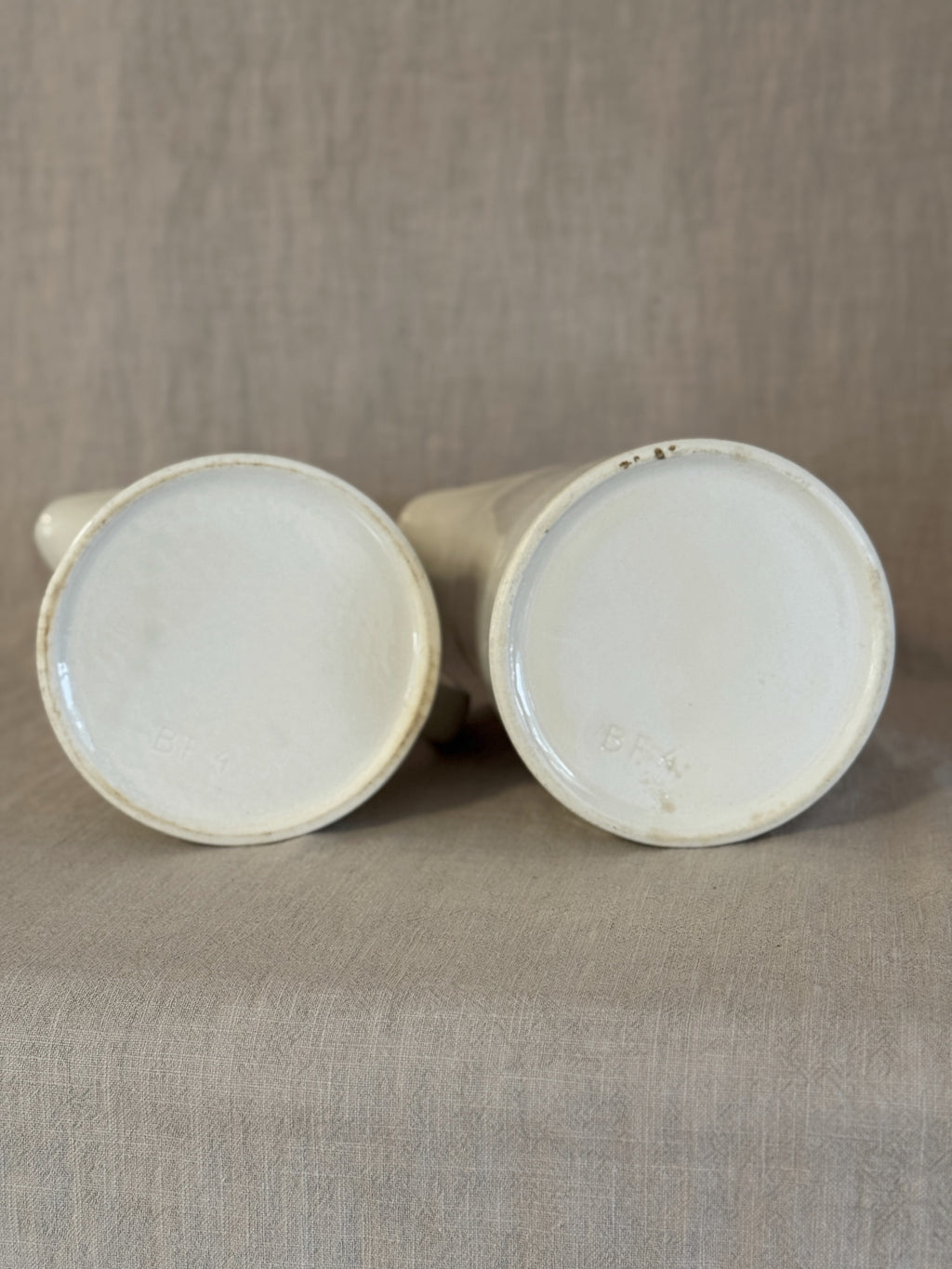 The two jugs on their sides showing both bases