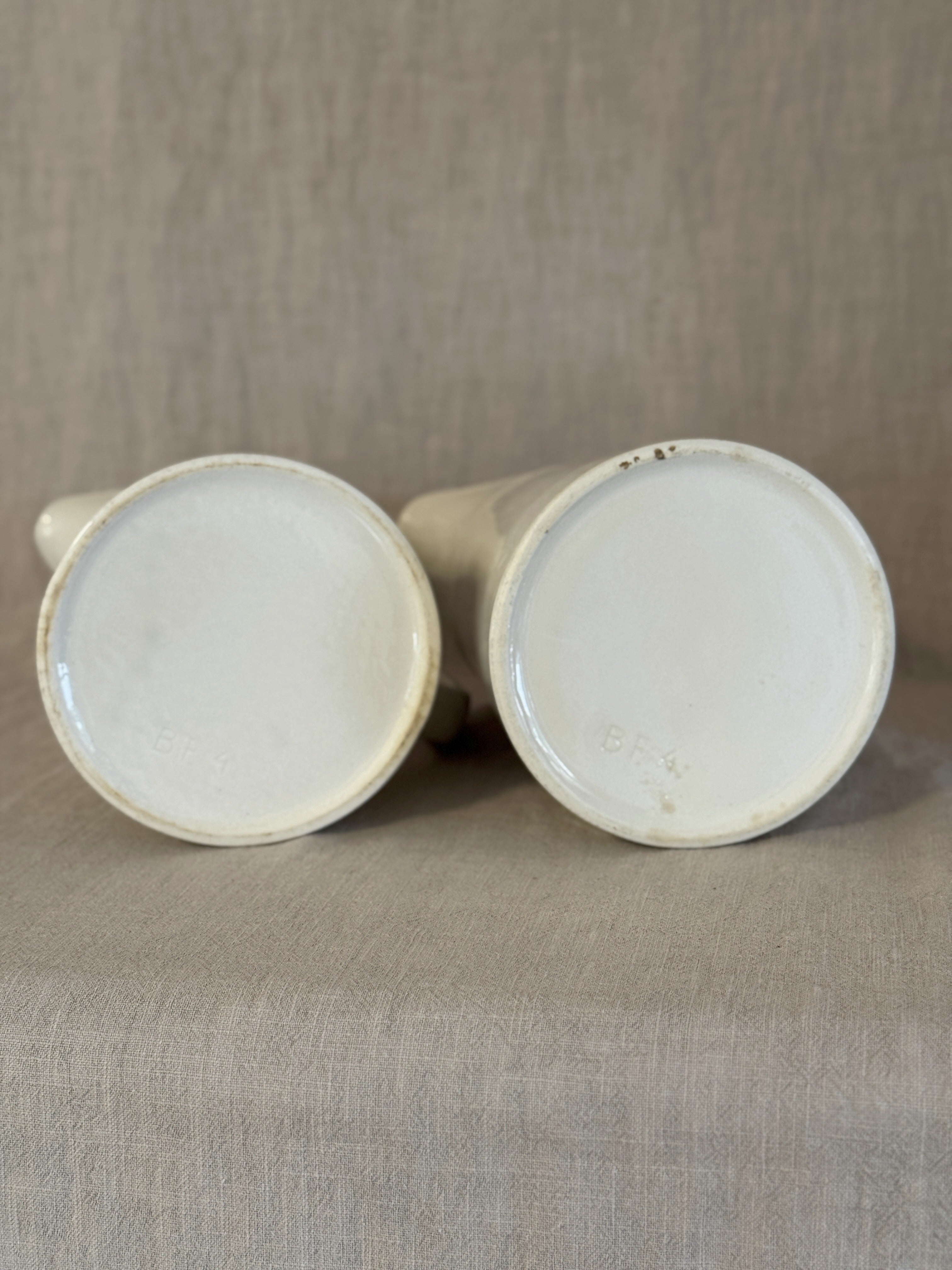 The two jugs on their sides showing both bases