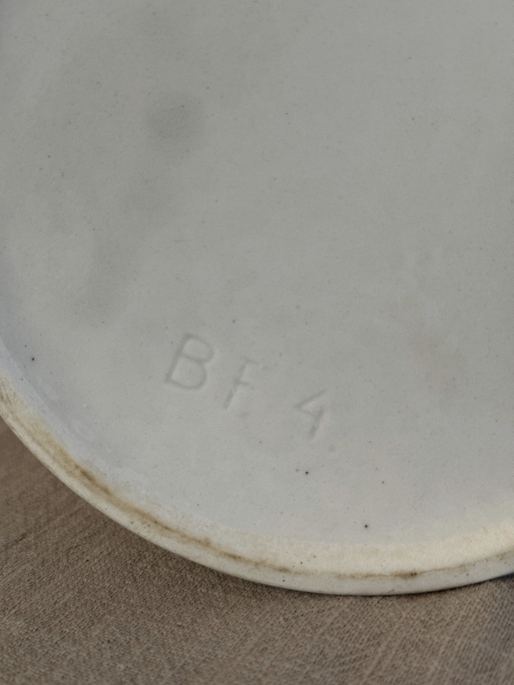 Base of the tall white jug with an impressed BF 4 mould mark