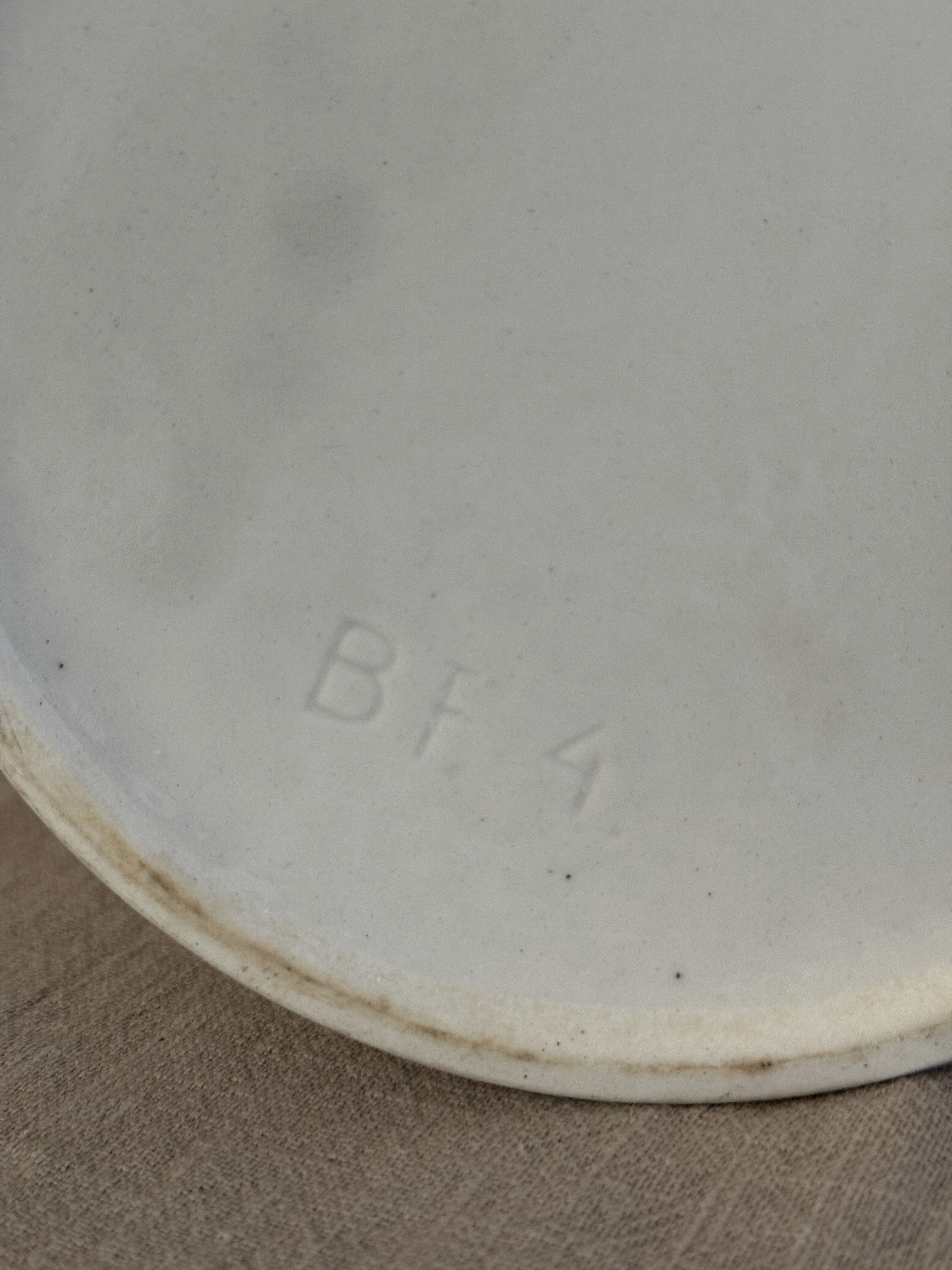 Base of the tall white jug with an impressed BF 4 mould mark