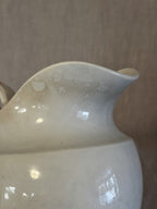 Close-up of the rim and neck showing the warm even softening of the glaze