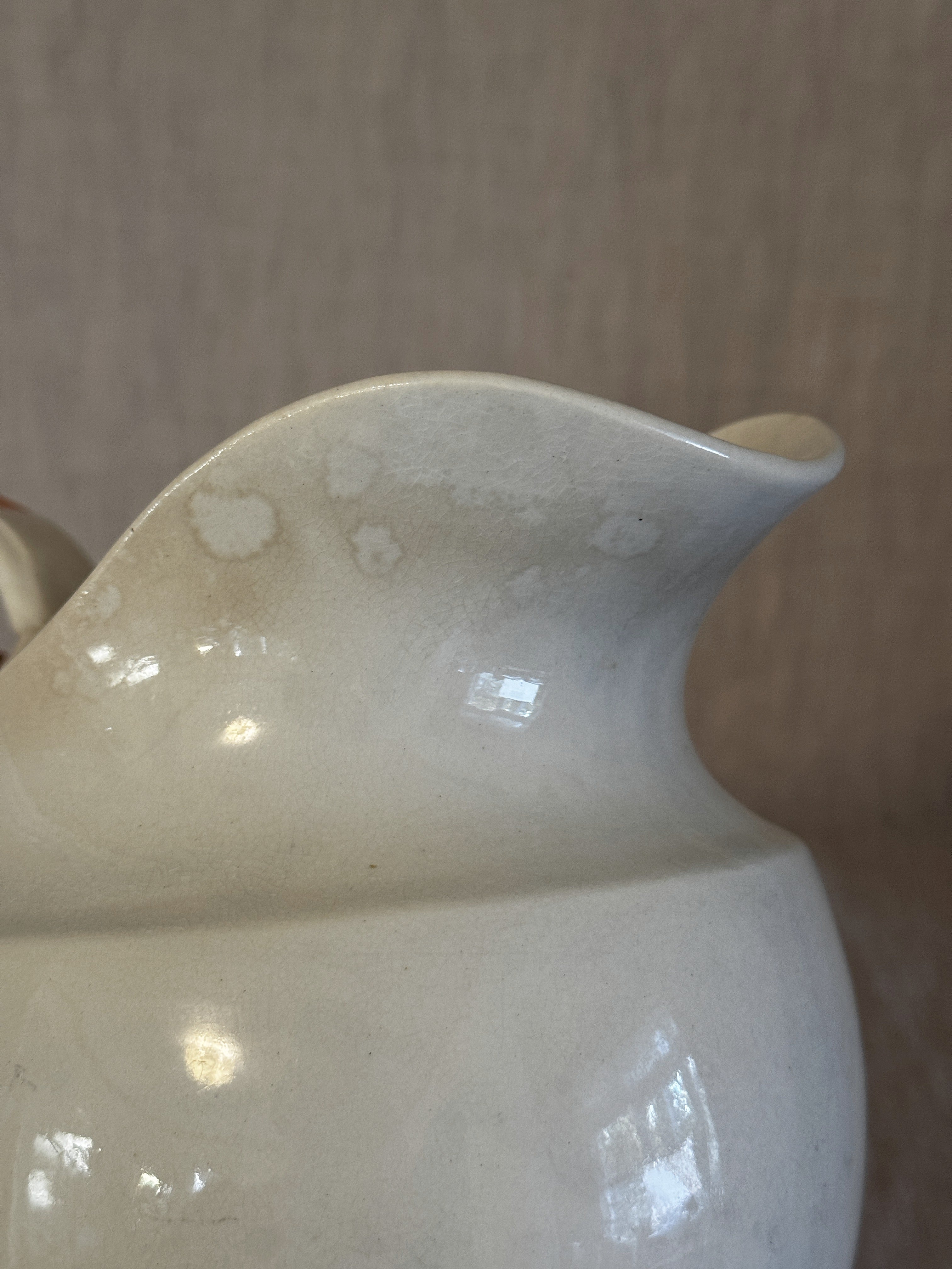 Close-up of the rim and neck showing the warm even softening of the glaze