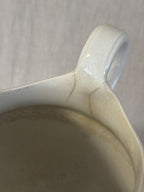 Detail of the handle where it meets the body of the washstand jug