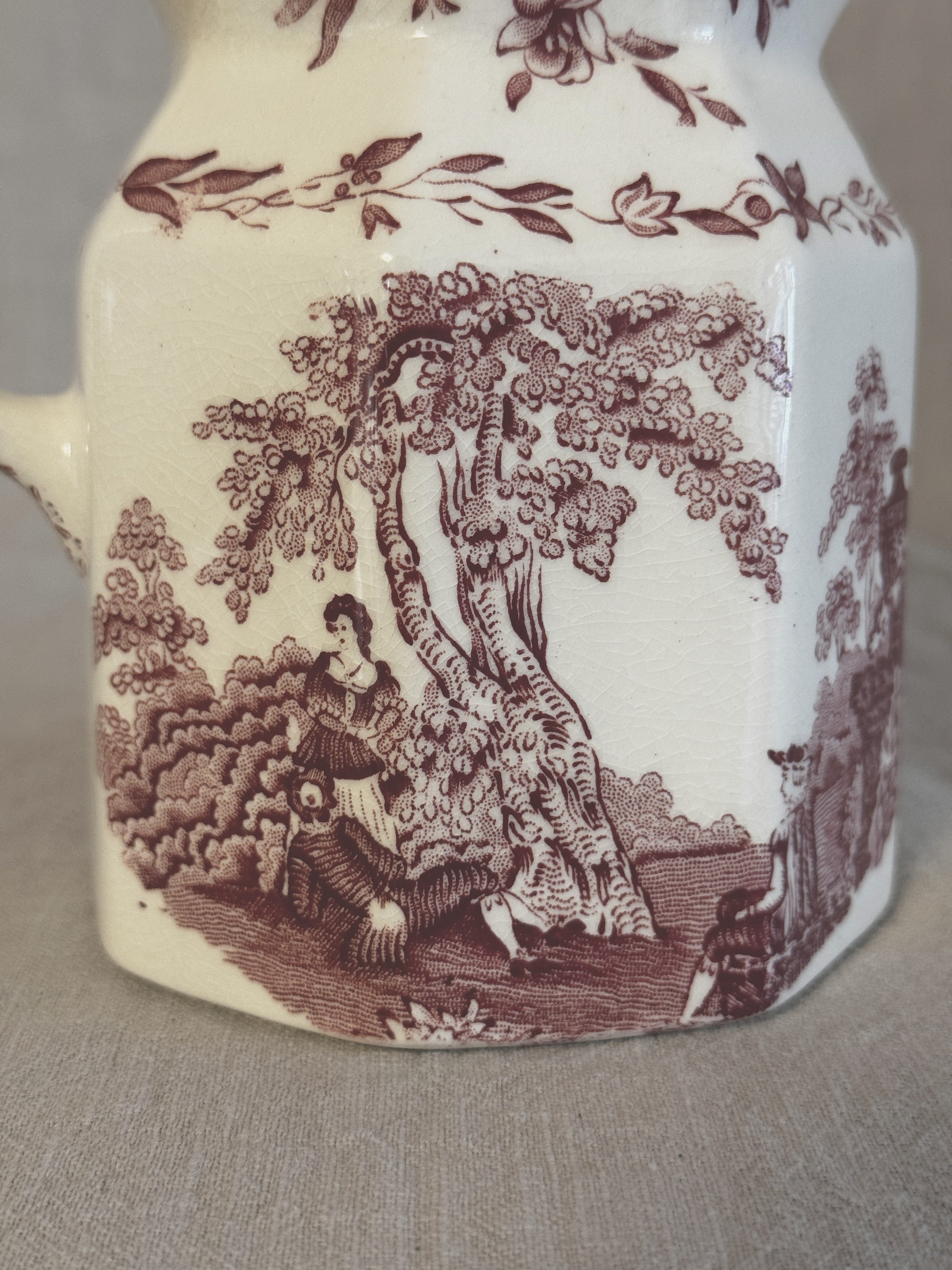 Close-up of the Watteau landscape print with figures in eighteenth-century dress