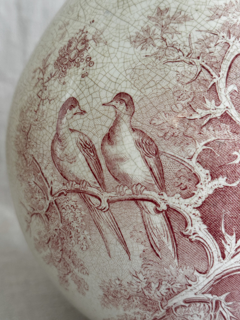 Detail of the upper body where the transfer pattern meets the fine crazing of the glaze