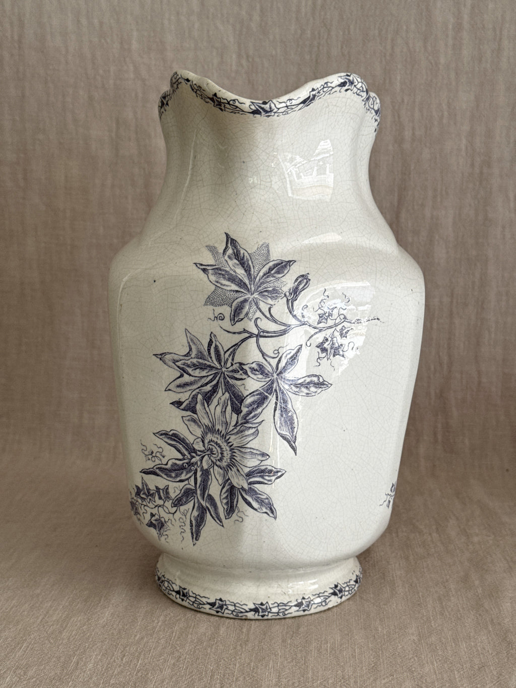 Angled view of the purple transferware jug showing the body and neck